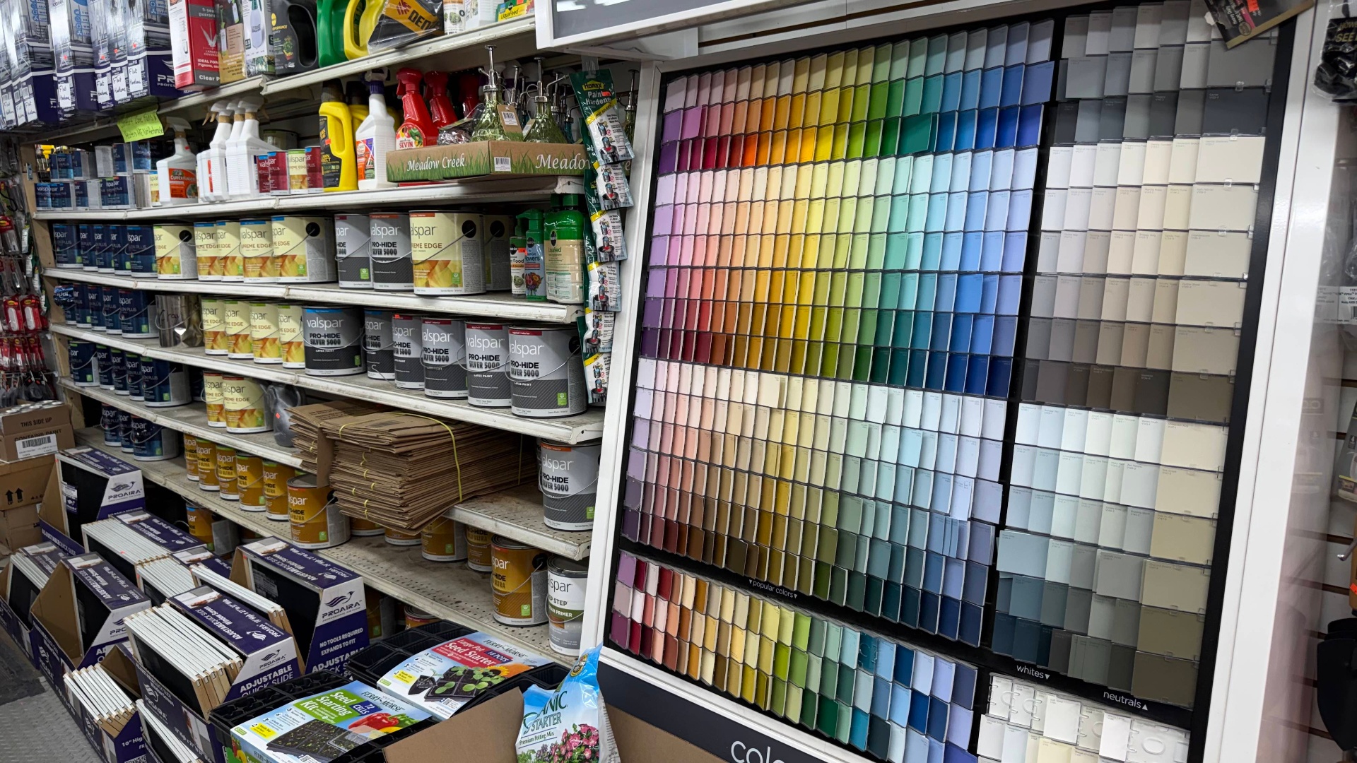 Valspar paint cans and full color sample wall at Flat Hardware